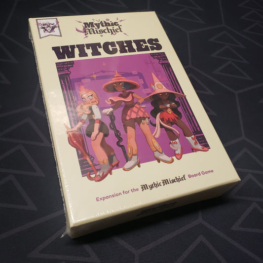 Image shows the front cover of the box of the Witches expansion for the board game Mythic Mischief