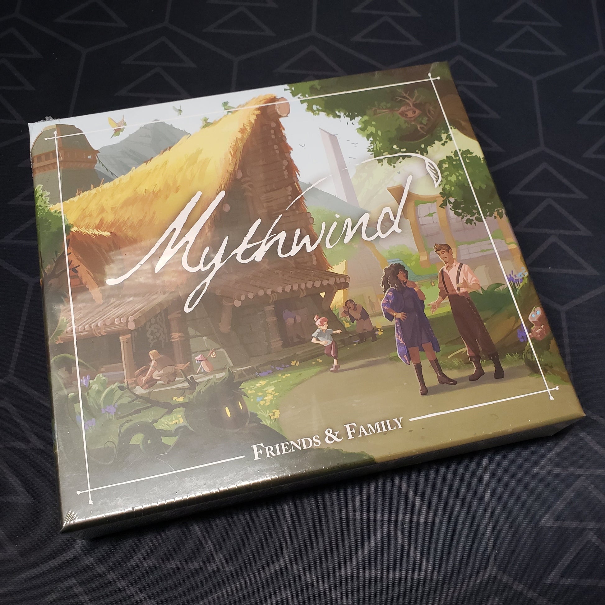 Image shows the front cover of the box of the Friends & Family expansion for the board game Mythwind