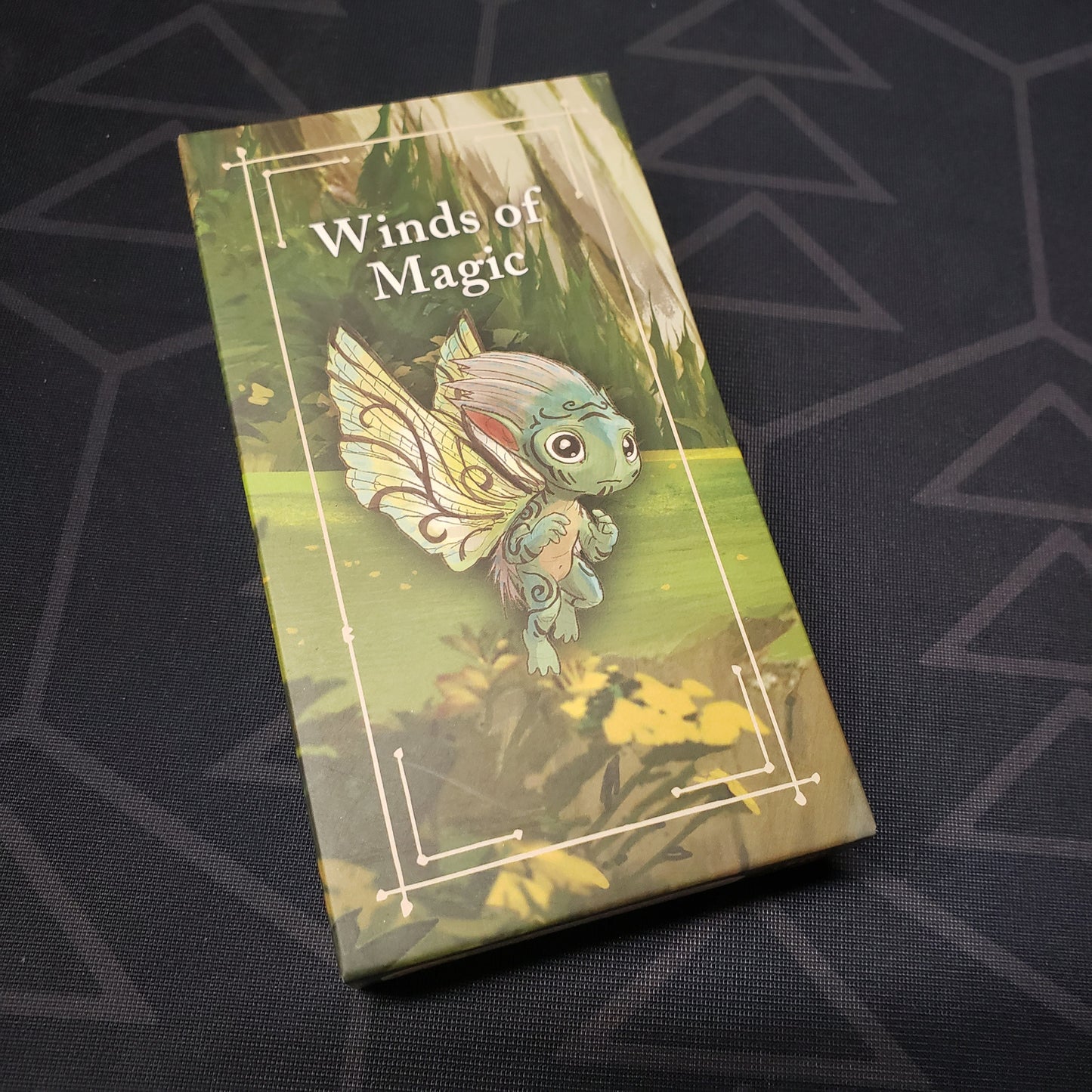 Image shows the front of the box for the Winds of Magic mini expansion for the board game Mythwind