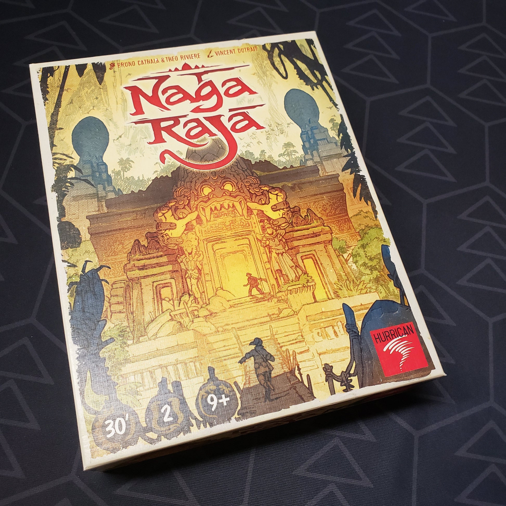 Image shows the front cover of the box for the Naga Raja board game