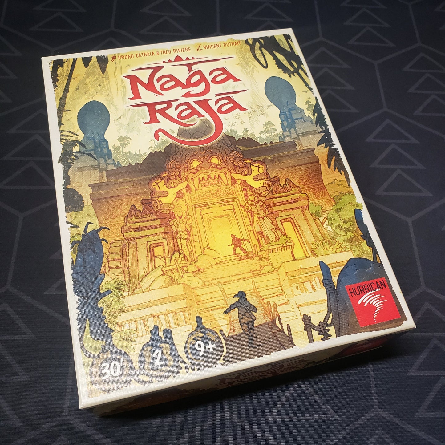 Image shows the front cover of the box for the Naga Raja board game