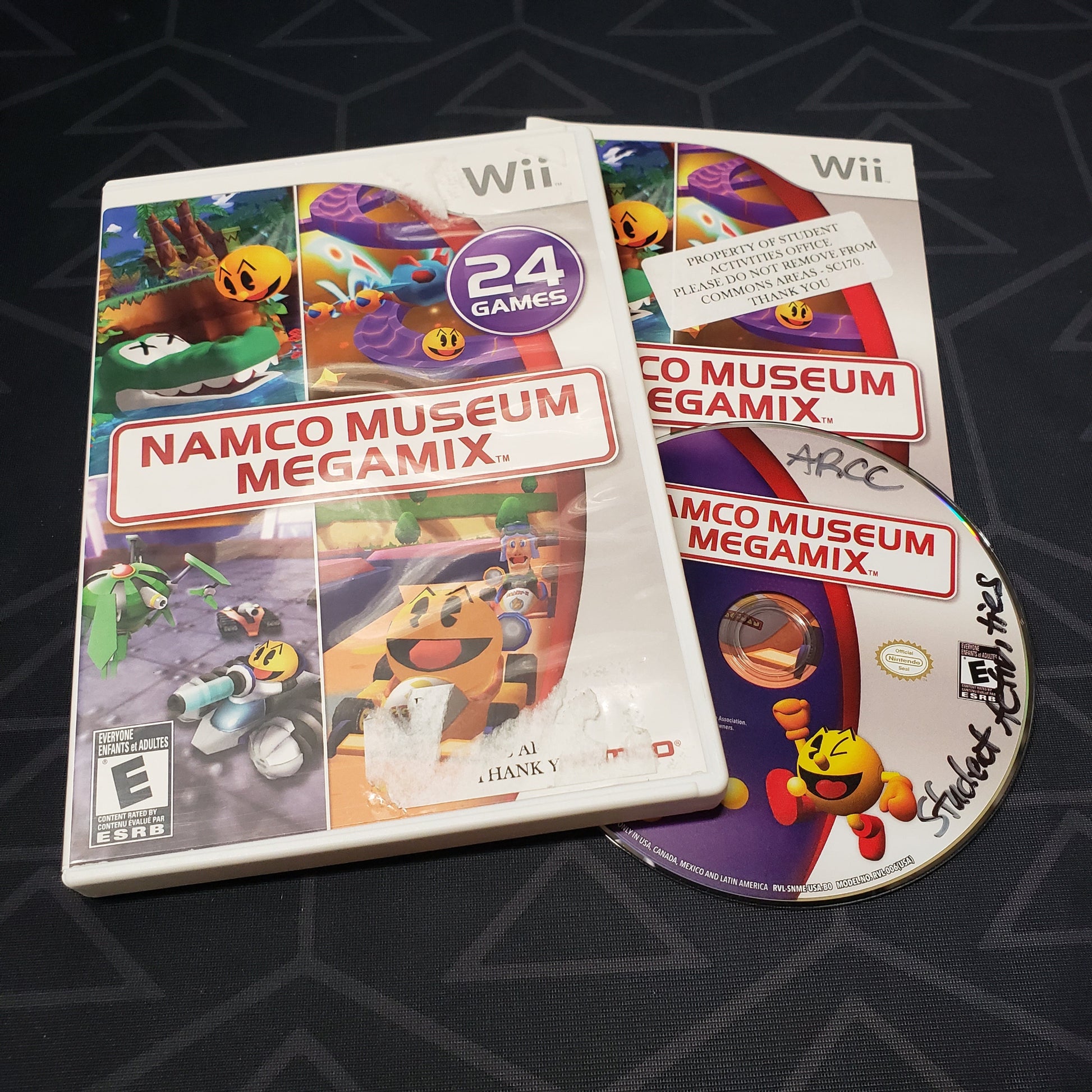 Image shows the case, manual and disc for the video game Namco Museum Megamix for Nintendo Wii