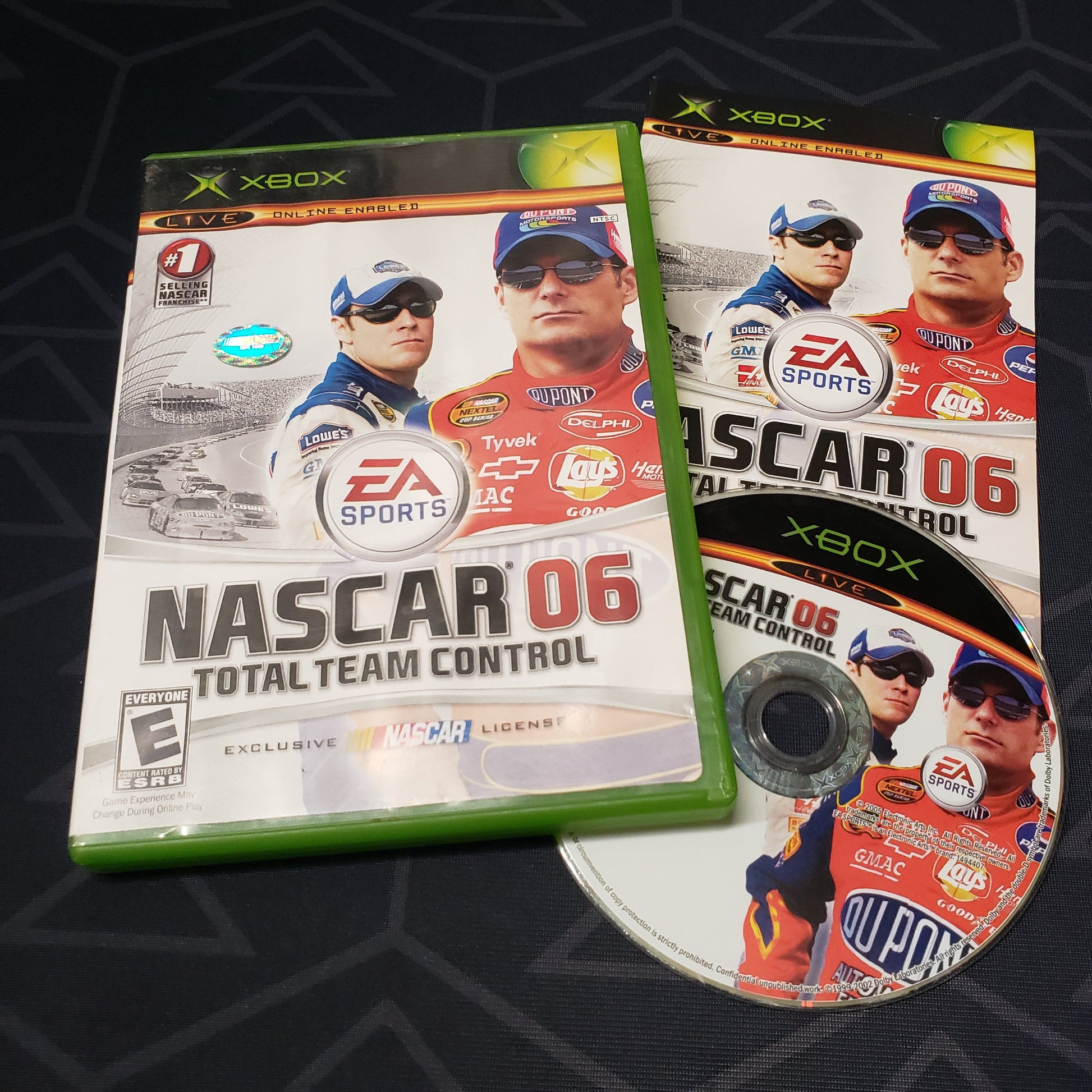 Image shows the case, manual & disc for the video game NASCAR 06: Total Team Control for Xbox
