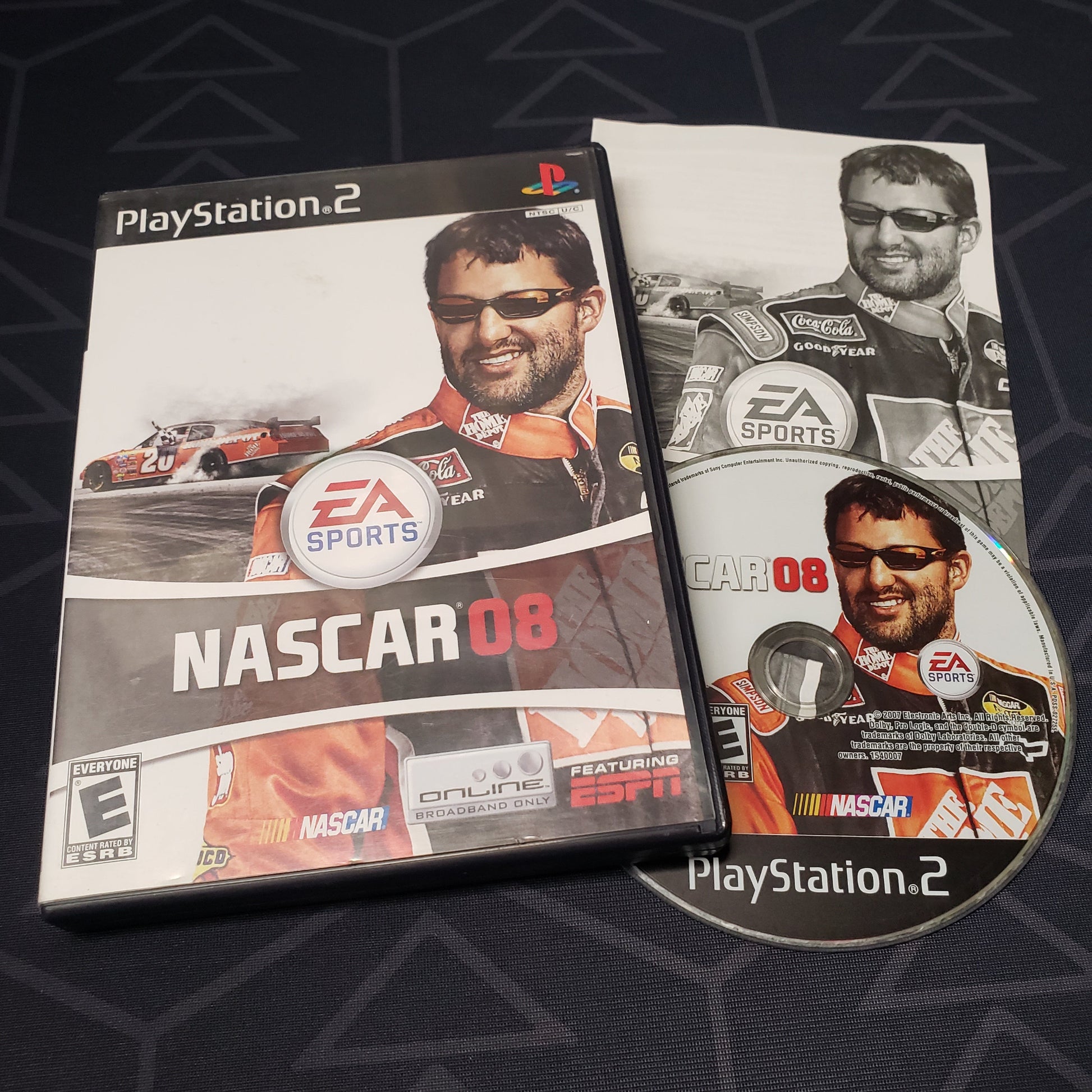 Image shows the case, manual & disc for the video game NASCAR 08 for Playstation 2