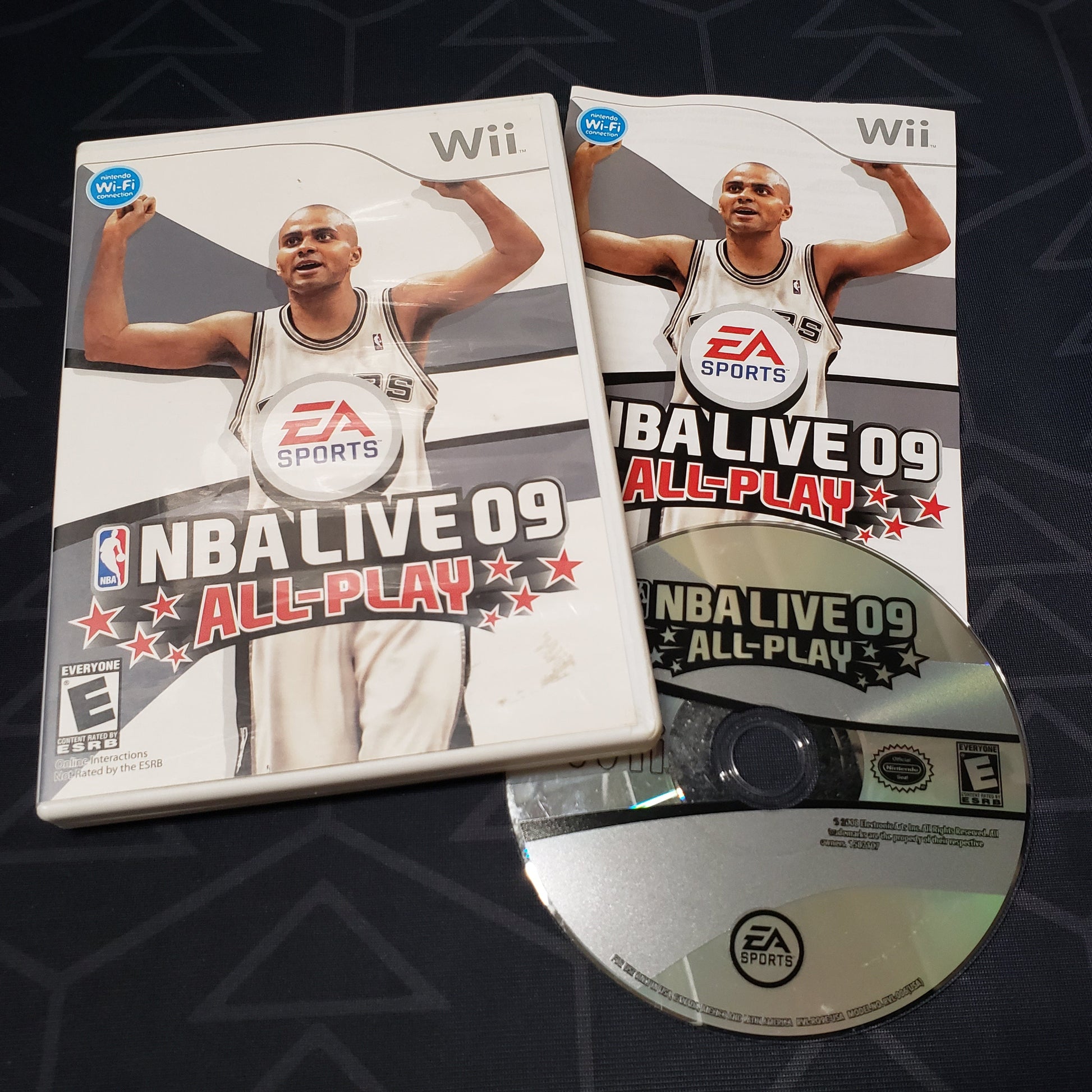 Image shows the case, manual and disc for the video game NBA Live 09 All-Play for Nintendo Wii
