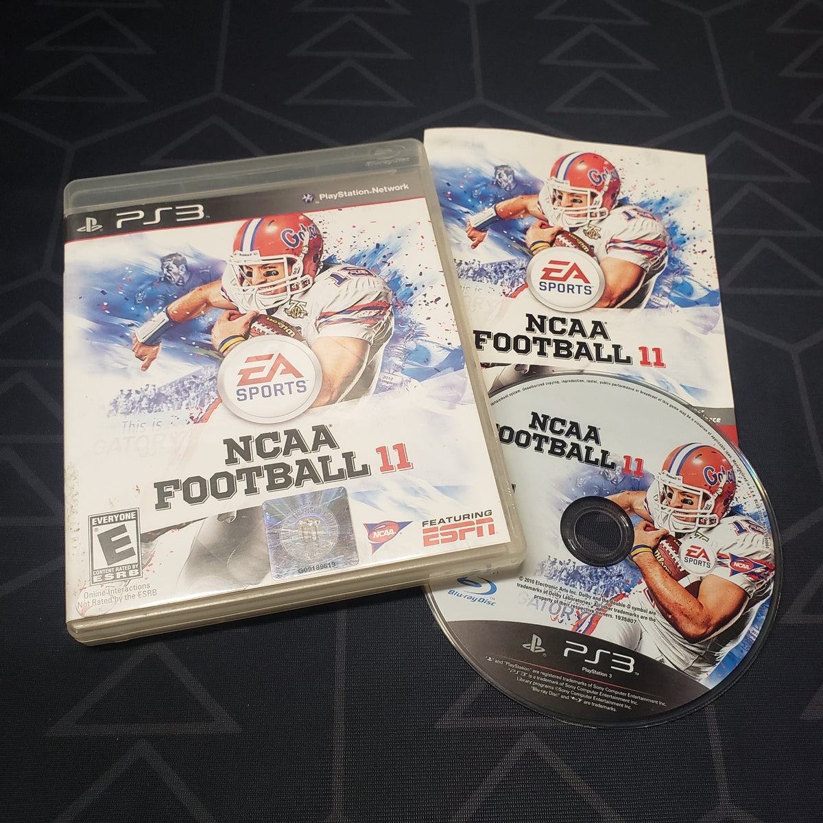 Image shows the case, manual and disc for the video game NCAA Football 11 for Playstation 3