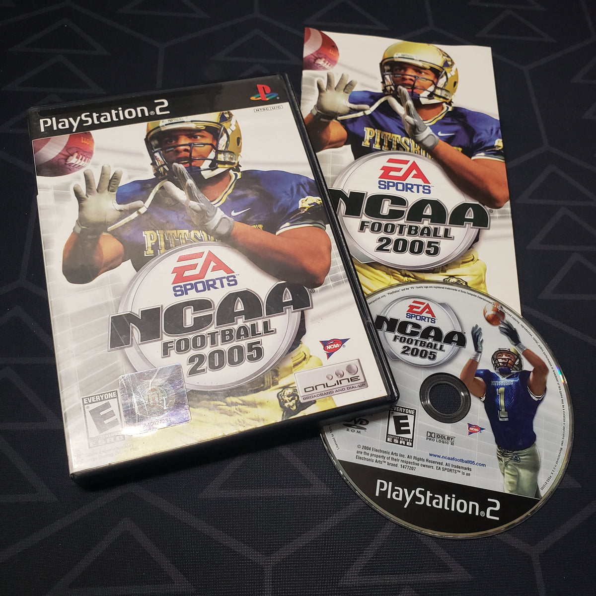 Image shows the case, manual and disc for the video game NCAA Football 2005 for Playstation 2