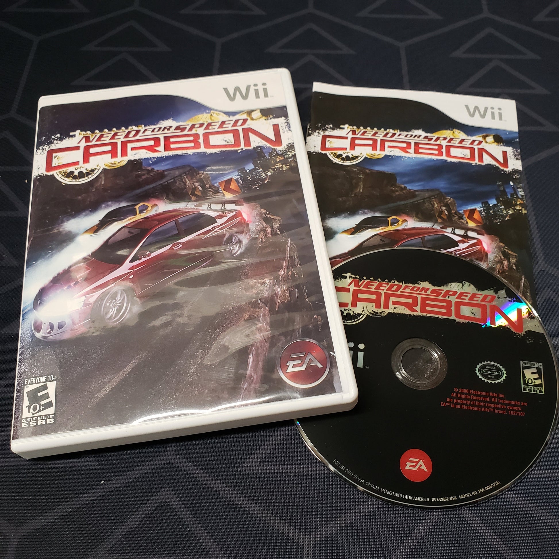 Image shows the case, manual & disc for the video game Need for Speed: Carbon for Nintendo Wii