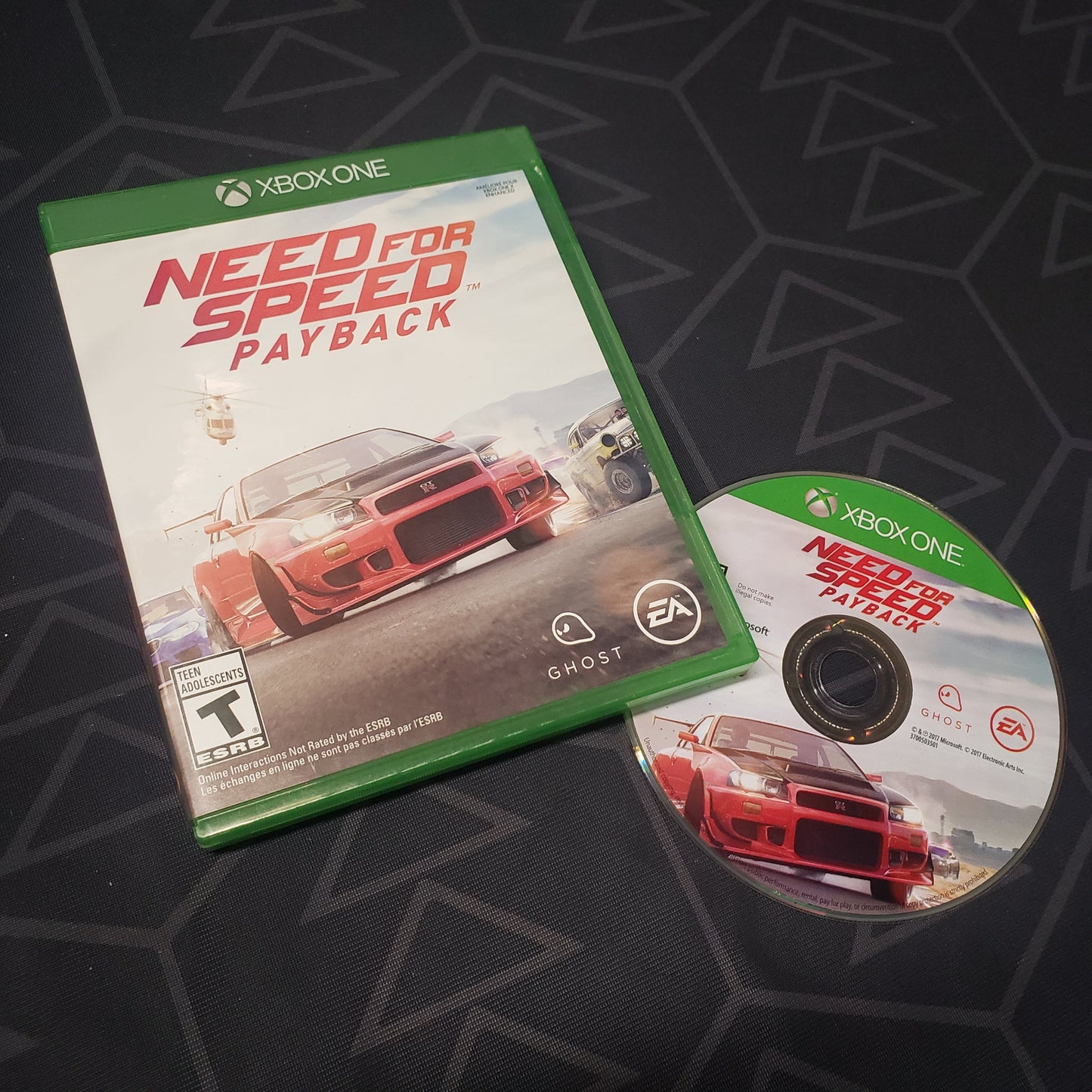 Image shows the case and disc for the video game Need For Speed: Payback for Xbox One