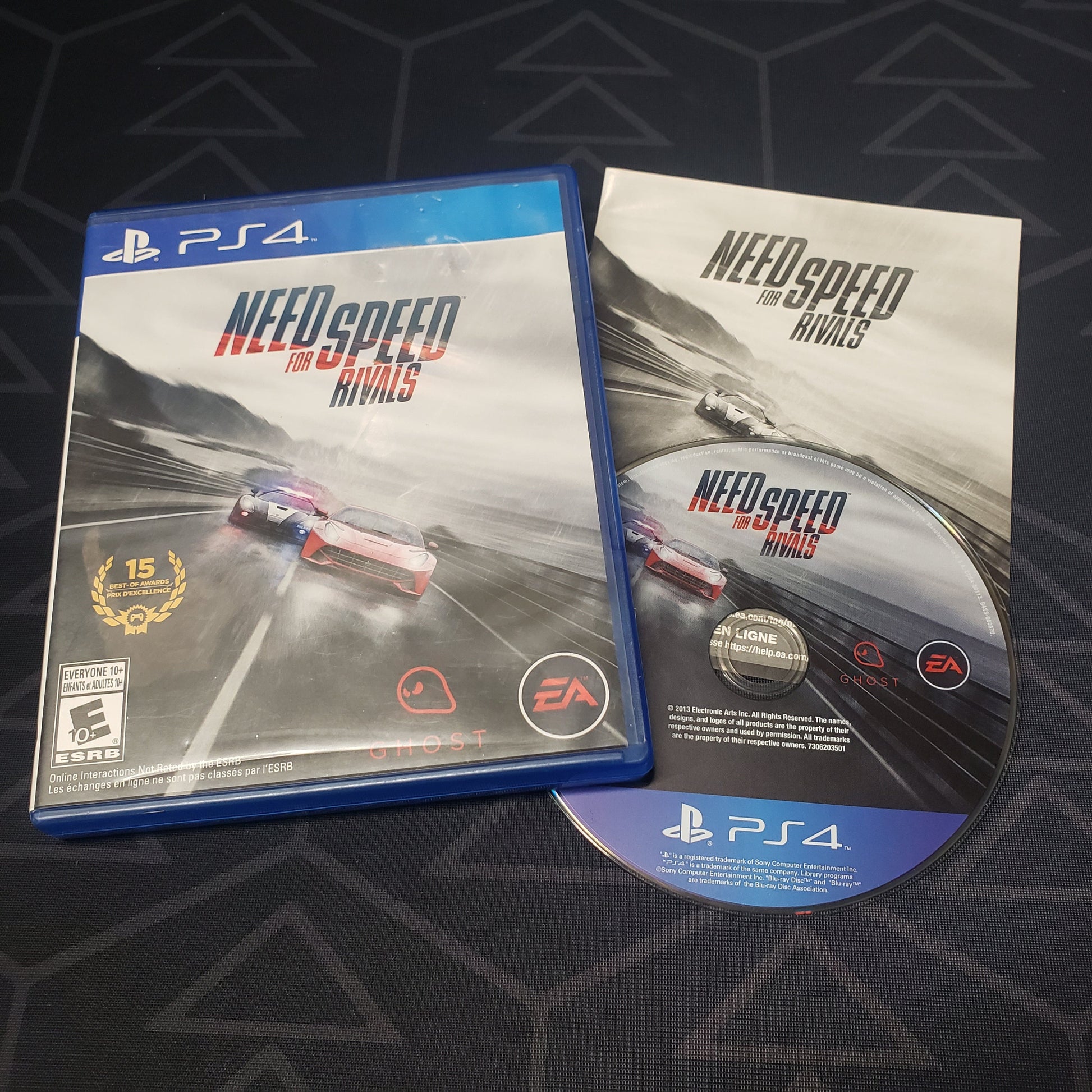 Image shows the case, manual & disc for the video game Need For Speed: Rivals for Playstation 4