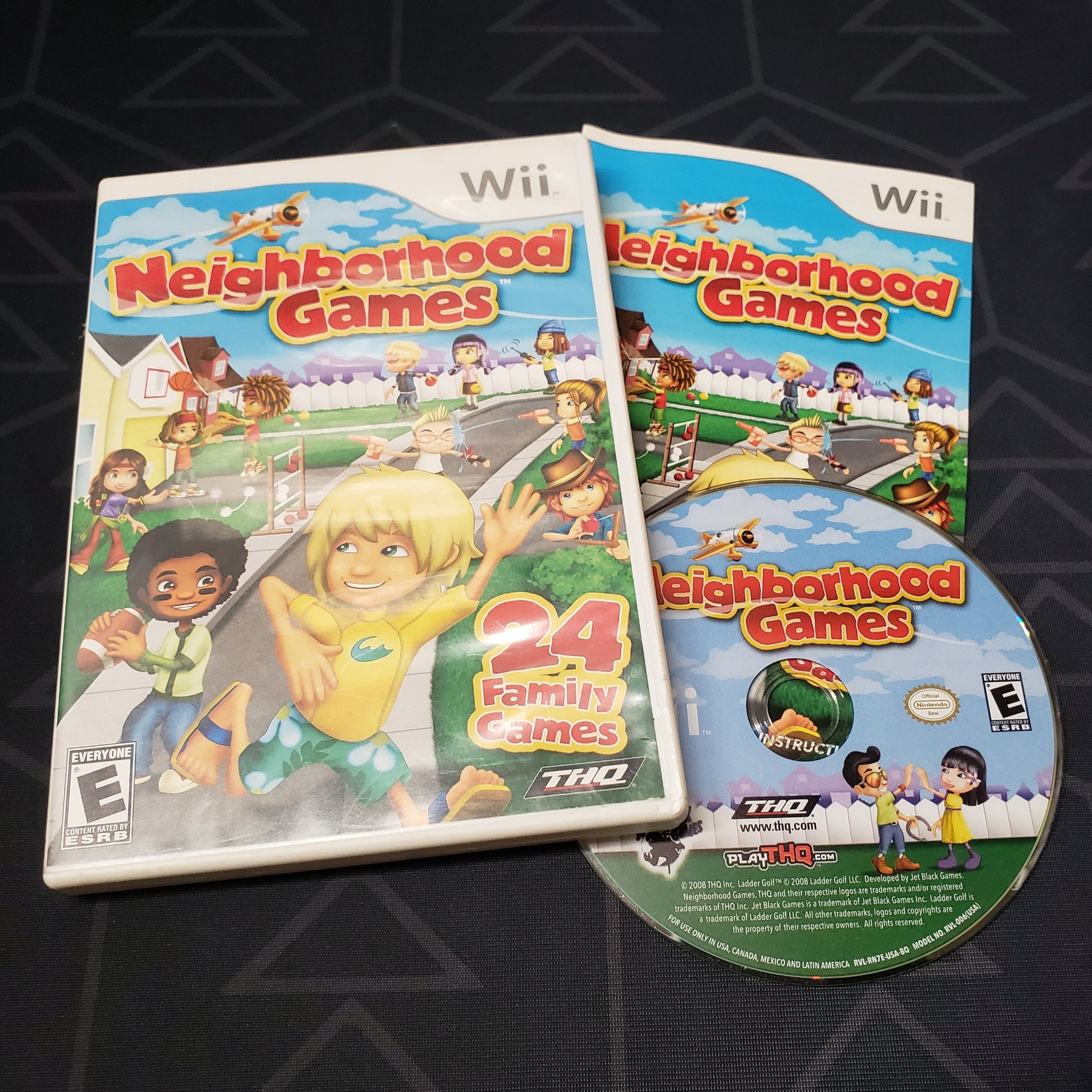 Image shows the case, manual and disc for the video game Neighborhood Games for Nintendo Wii