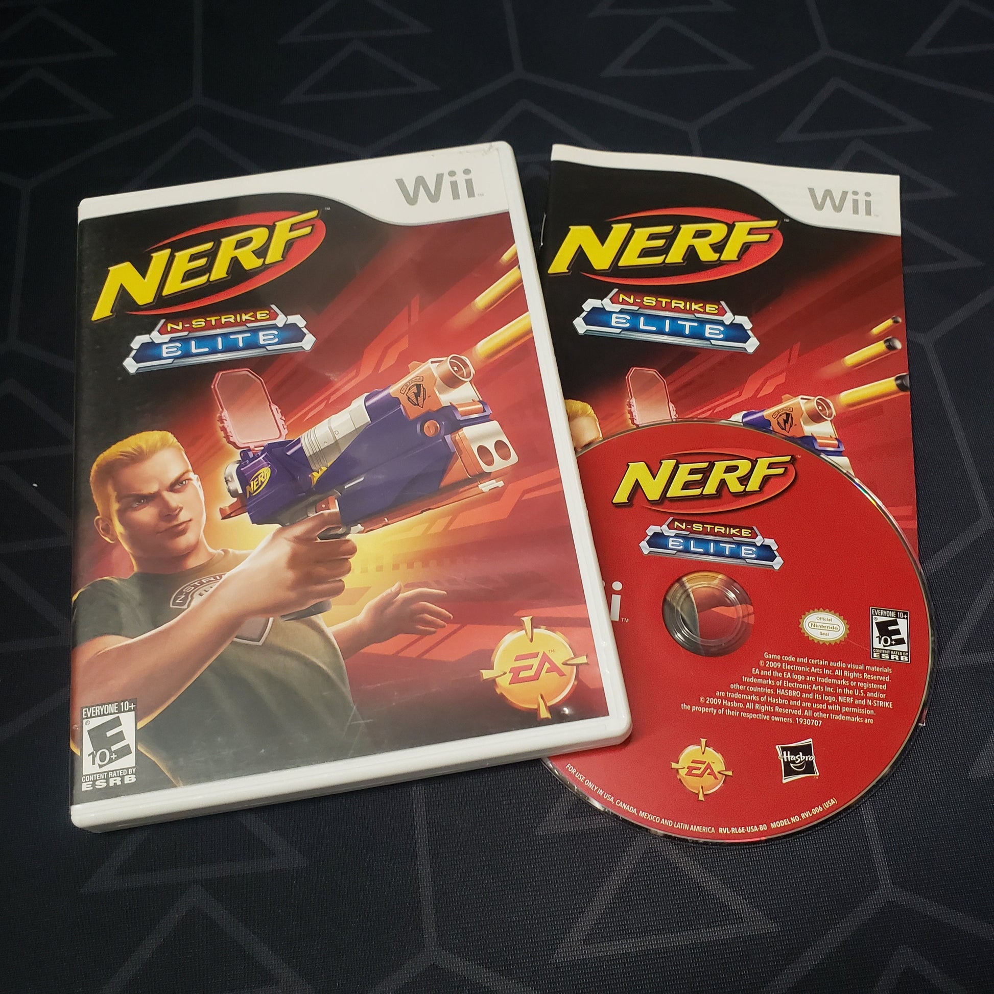 Image shows the case, manual & disc for the video game NERF N-Strike Elite for Nintendo Wii