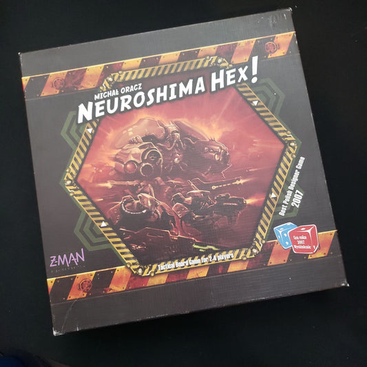 Image shows the front cover of the box of the Neuroshima Hex! board game