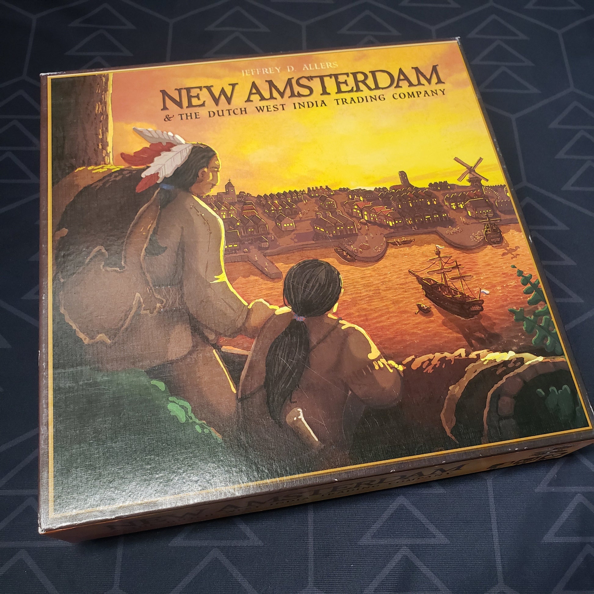 Image shows the front cover of the box for the New Amsterdam board game
