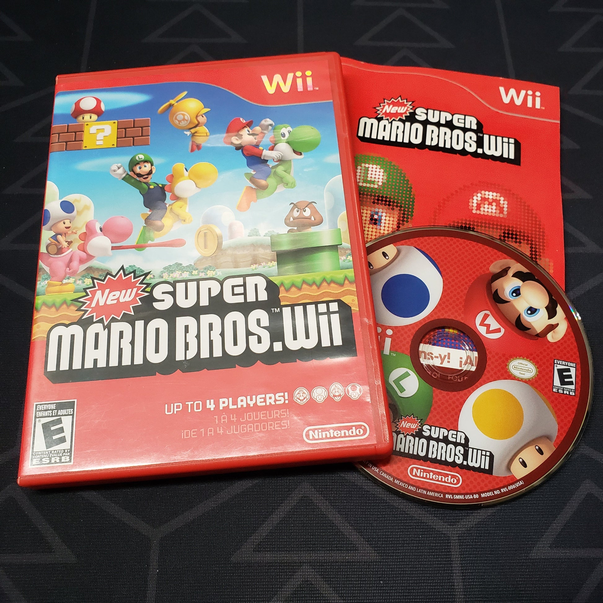 Image shows the case, manual & game disc for the video game New Super Mario Bros Wii for Nintendo Wii