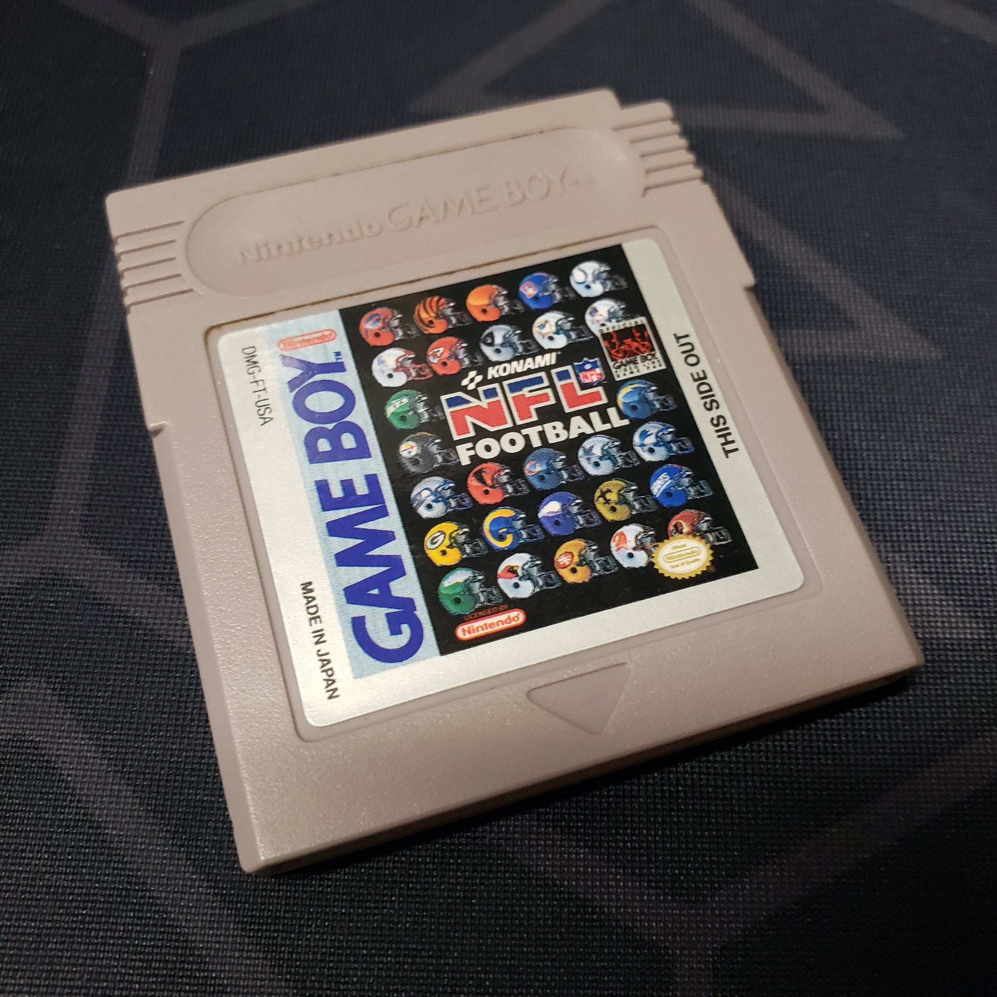 Image shows the front of the cartridge for the video game NFL Football for Nintendo Game Boy