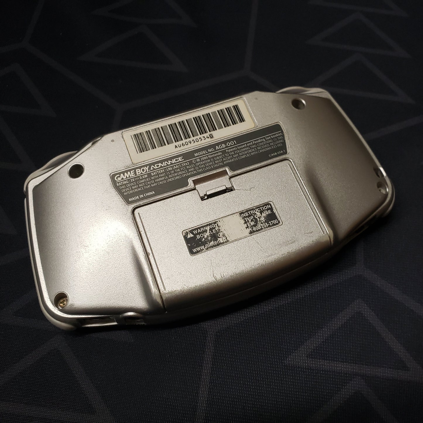 Image shows the back of a Game Boy Advance handheld console