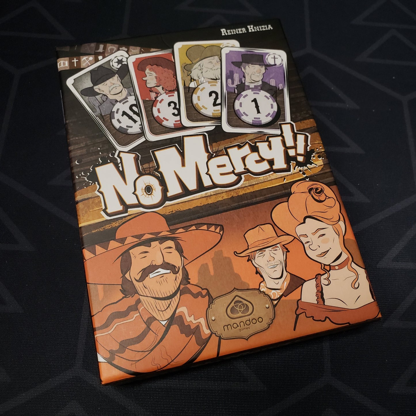 Image shows the front cover of the box for the No Mercy card game