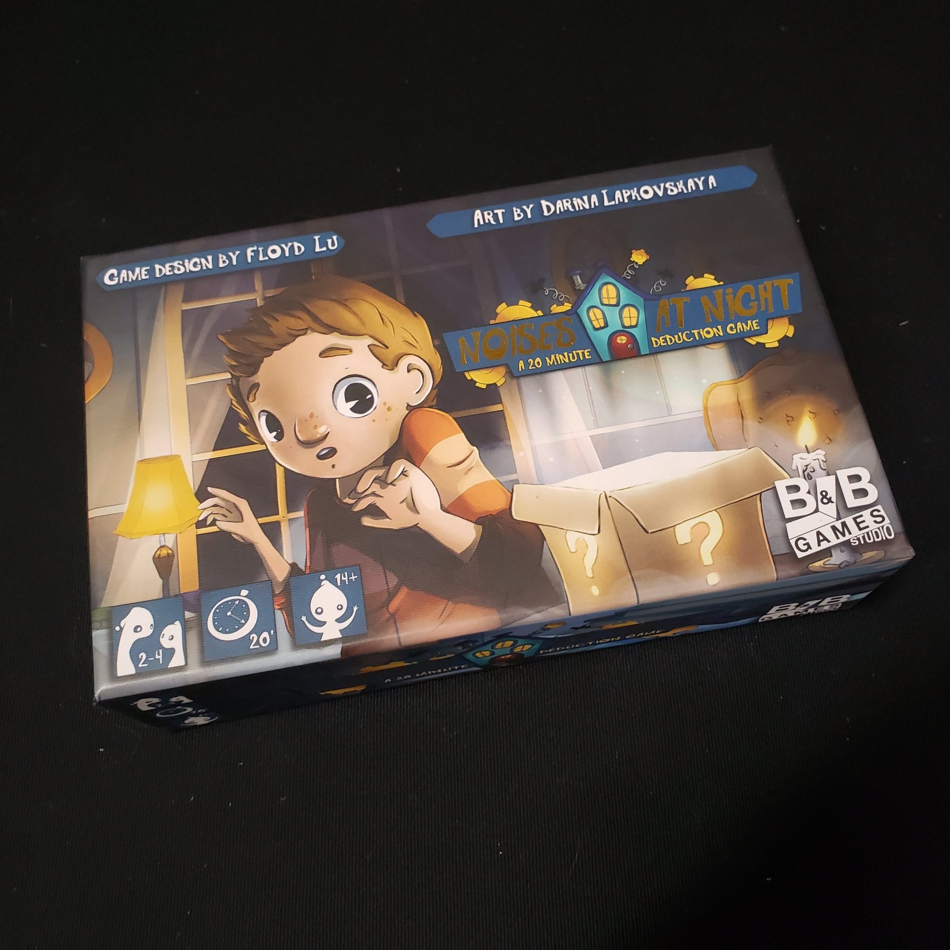 Image shows the front cover of the box of the Noises at Night board game