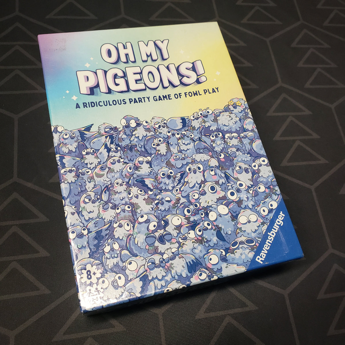 Image shows the front cover of the box for the Oh My Pigeons! card game