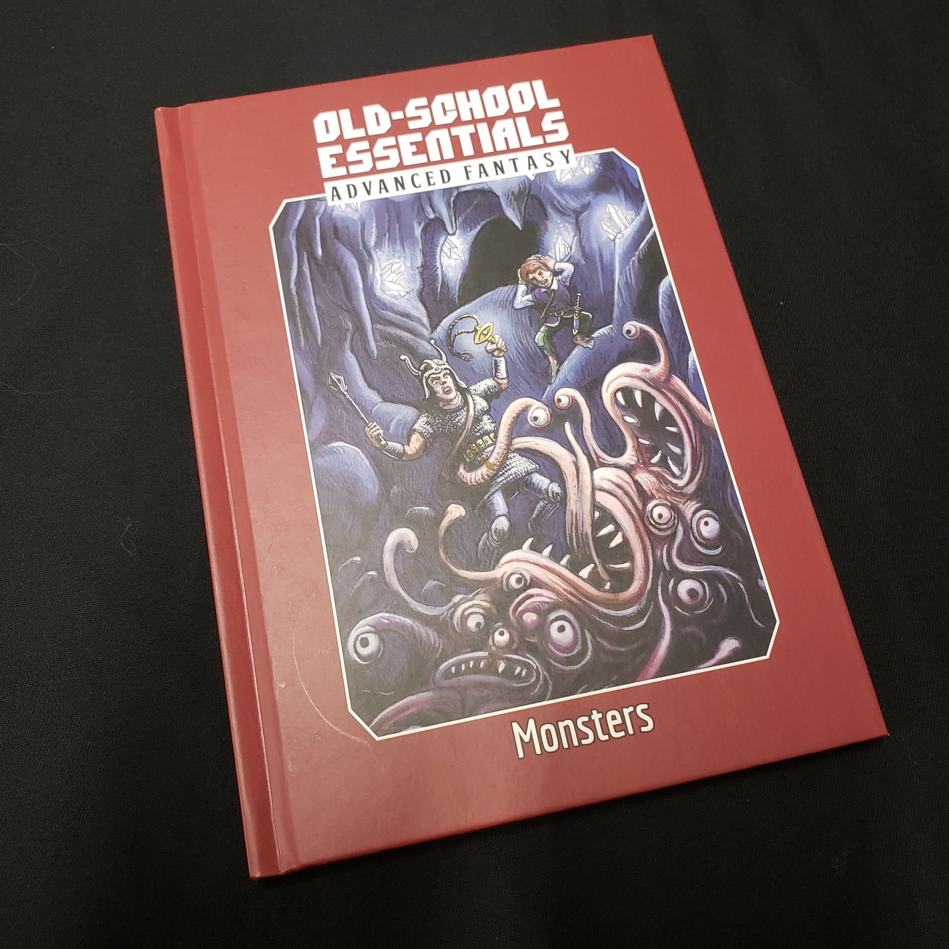 Image shows the front cover of the Monsters book for the Old-School Essentials roleplaying game