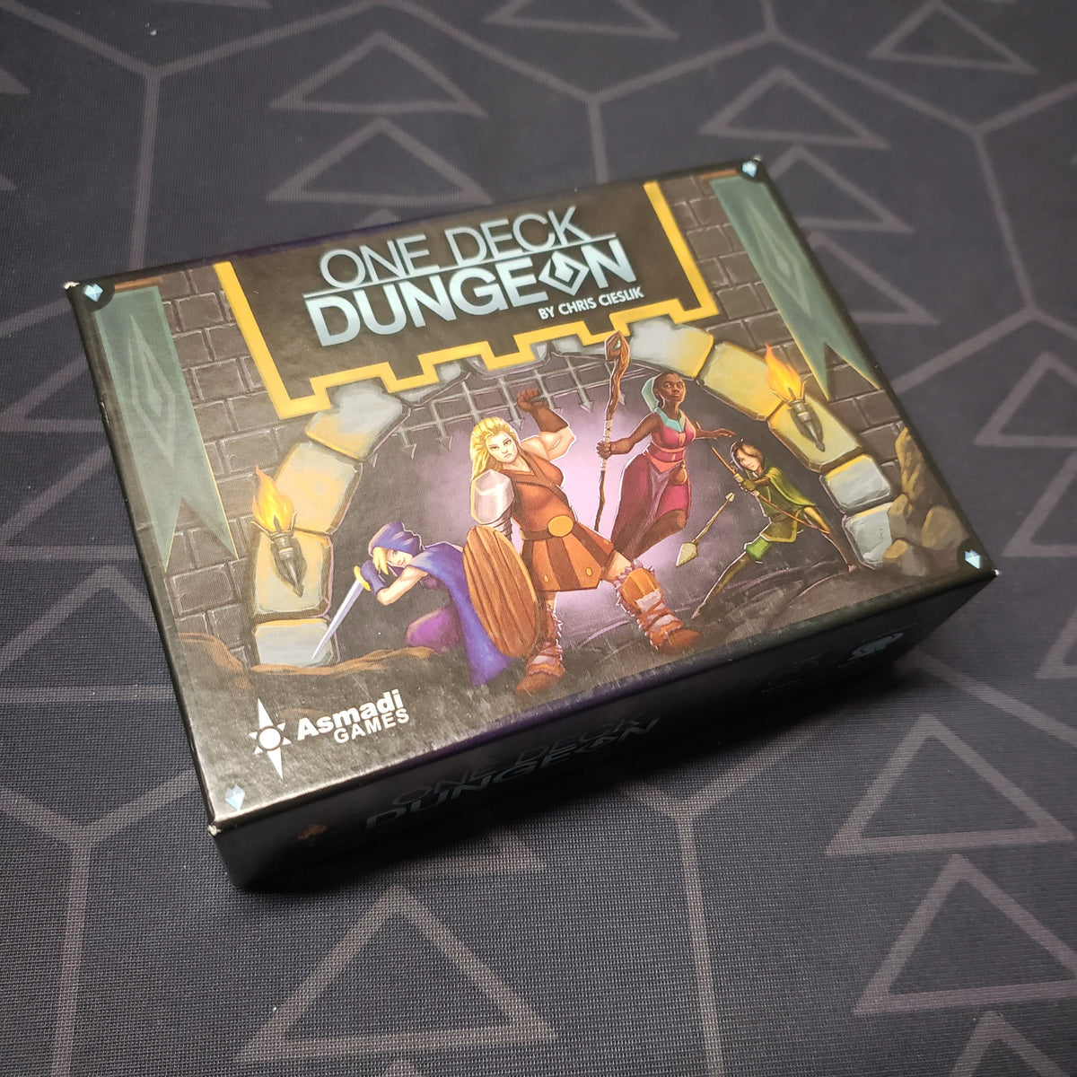 Image shows the front cover of the box of the One Deck Dungeon card game