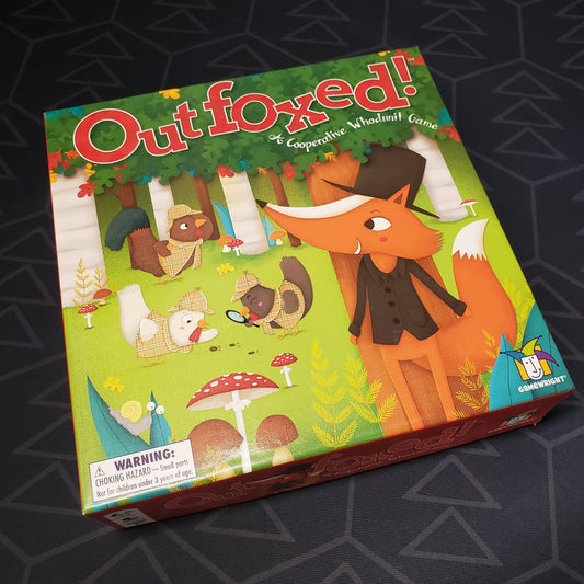 Image shows the front cover of the box of the Outfoxed board game