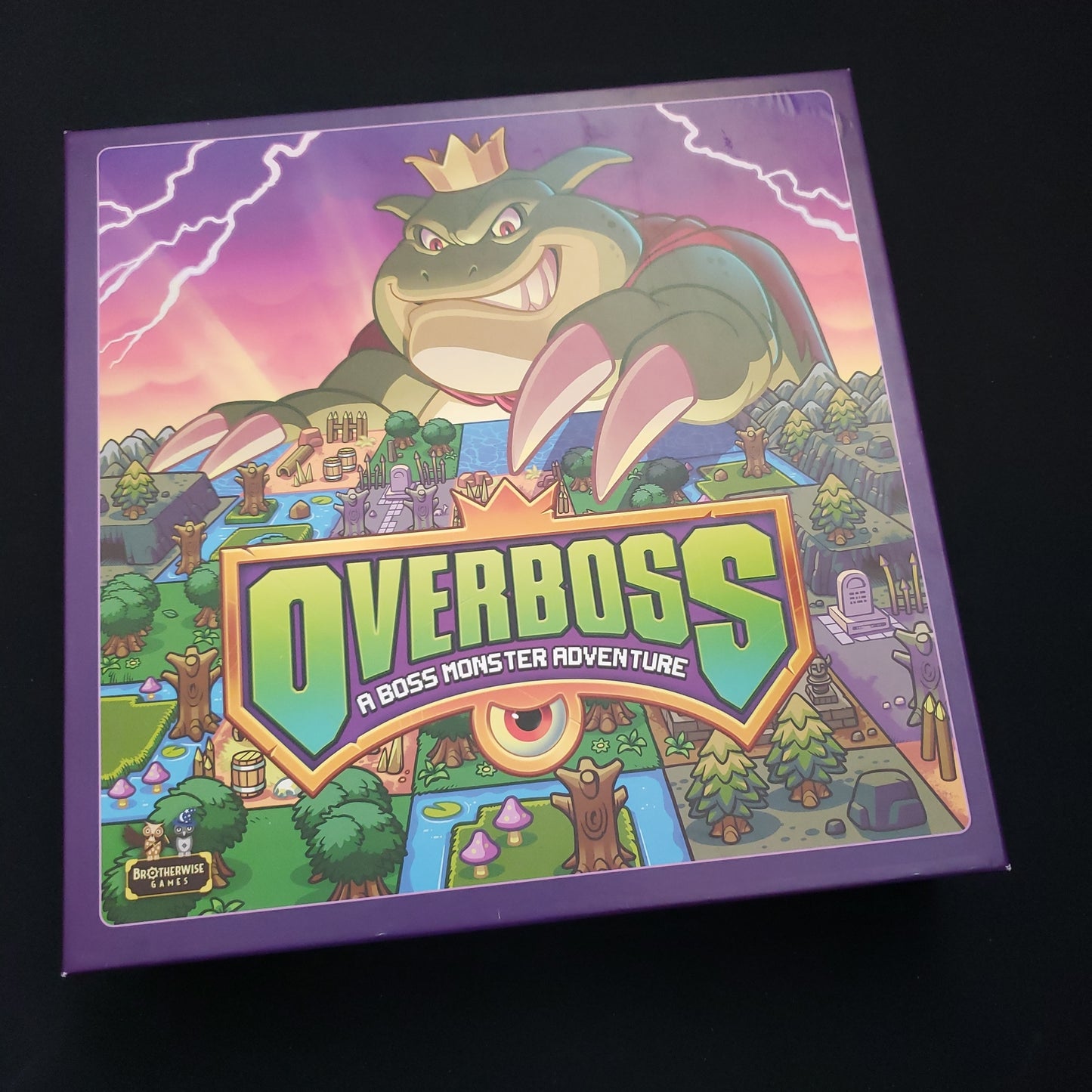 Image shows the front cover of the box of the Overboss board game