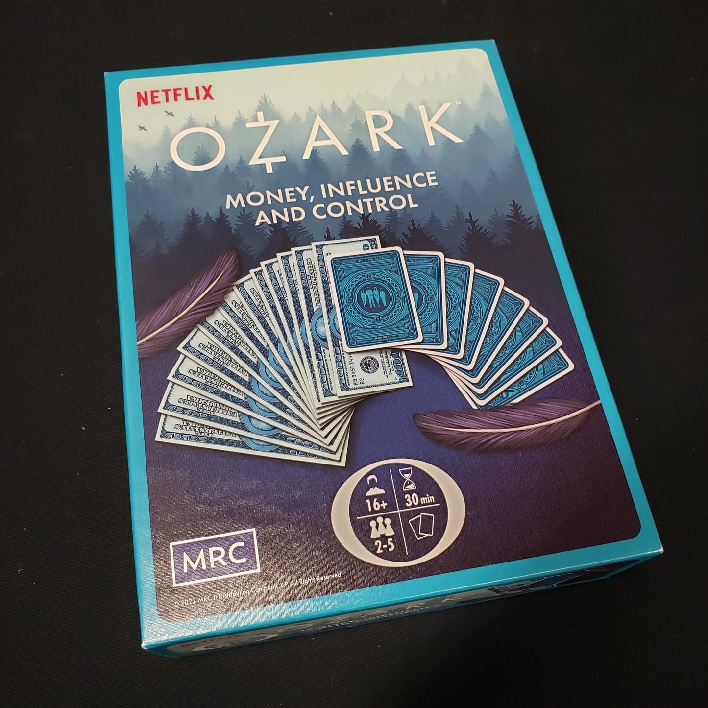 Image shows the front cover of the box of the Ozark: Money, Influence and Control board game