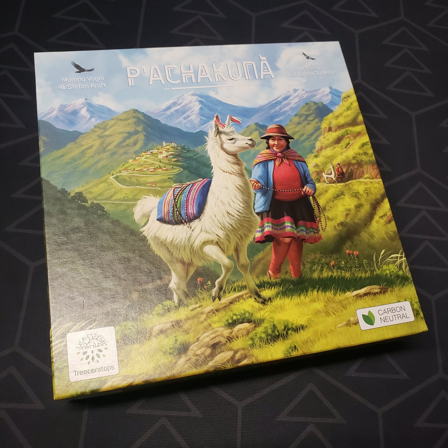 Image shows the front cover of the box for the P'achakuna board game