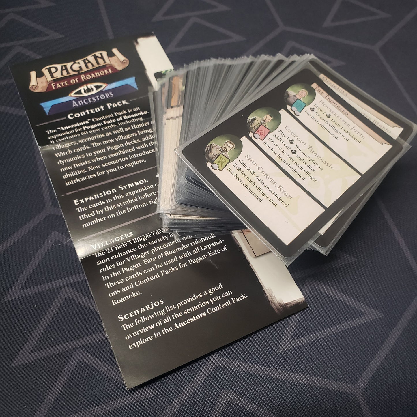 Image shows the fanned-out cards & instruction sheet for the Ancestors Content Pack expansion for the card game Pagan: Fate of Roanoke