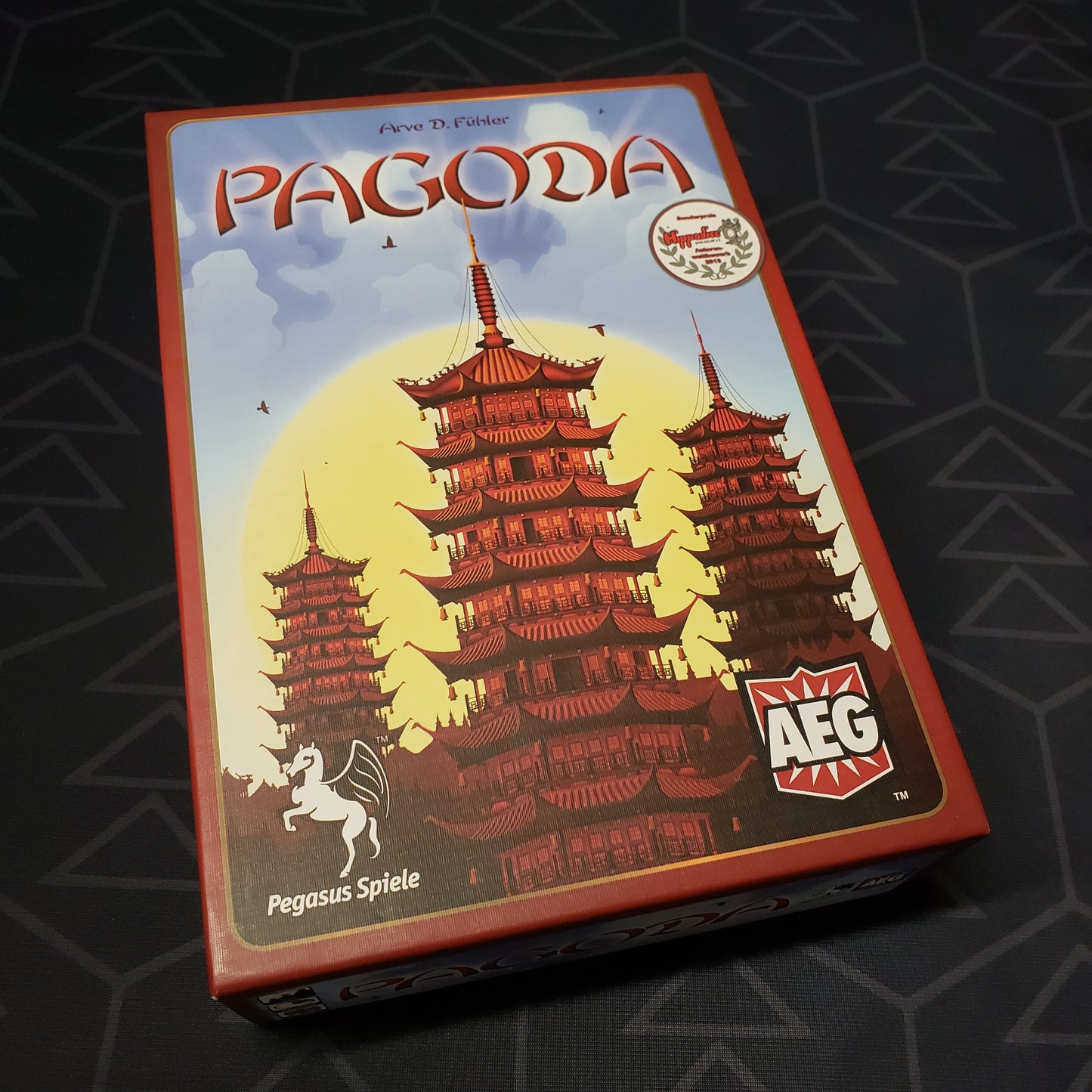 Image shows the front cover of the box of the Pagoda board game