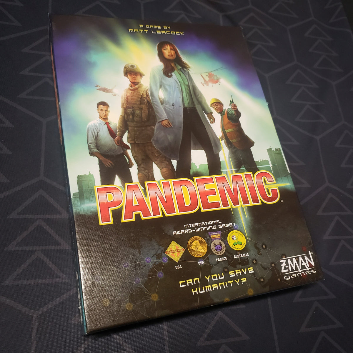 Image shows the front cover of the box of the Pandemic board game