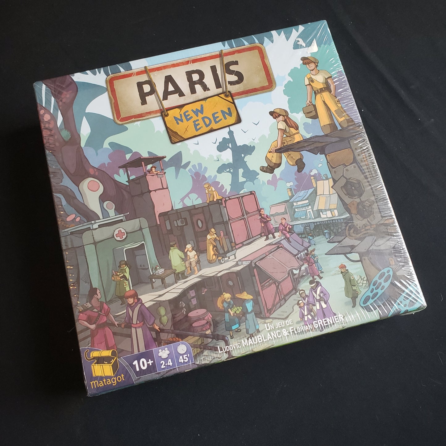 Image shows the front cover of the box of the board game Paris: New Eden