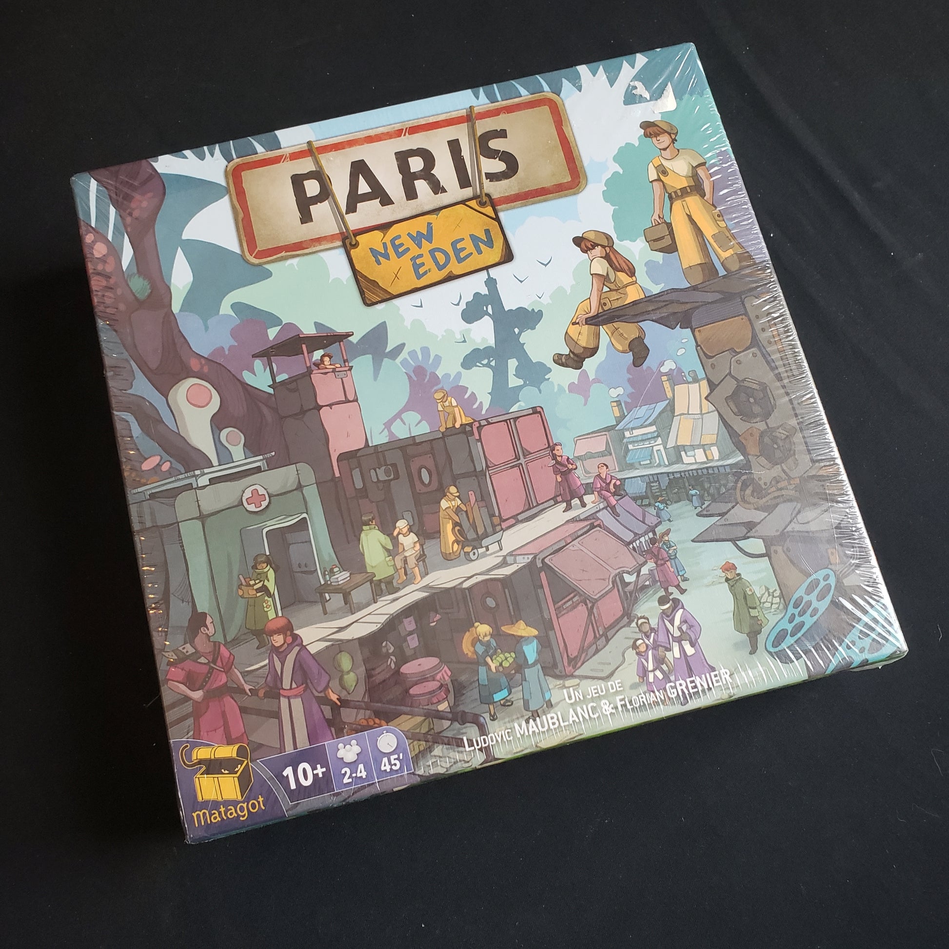 Image shows the front cover of the box of the board game Paris: New Eden
