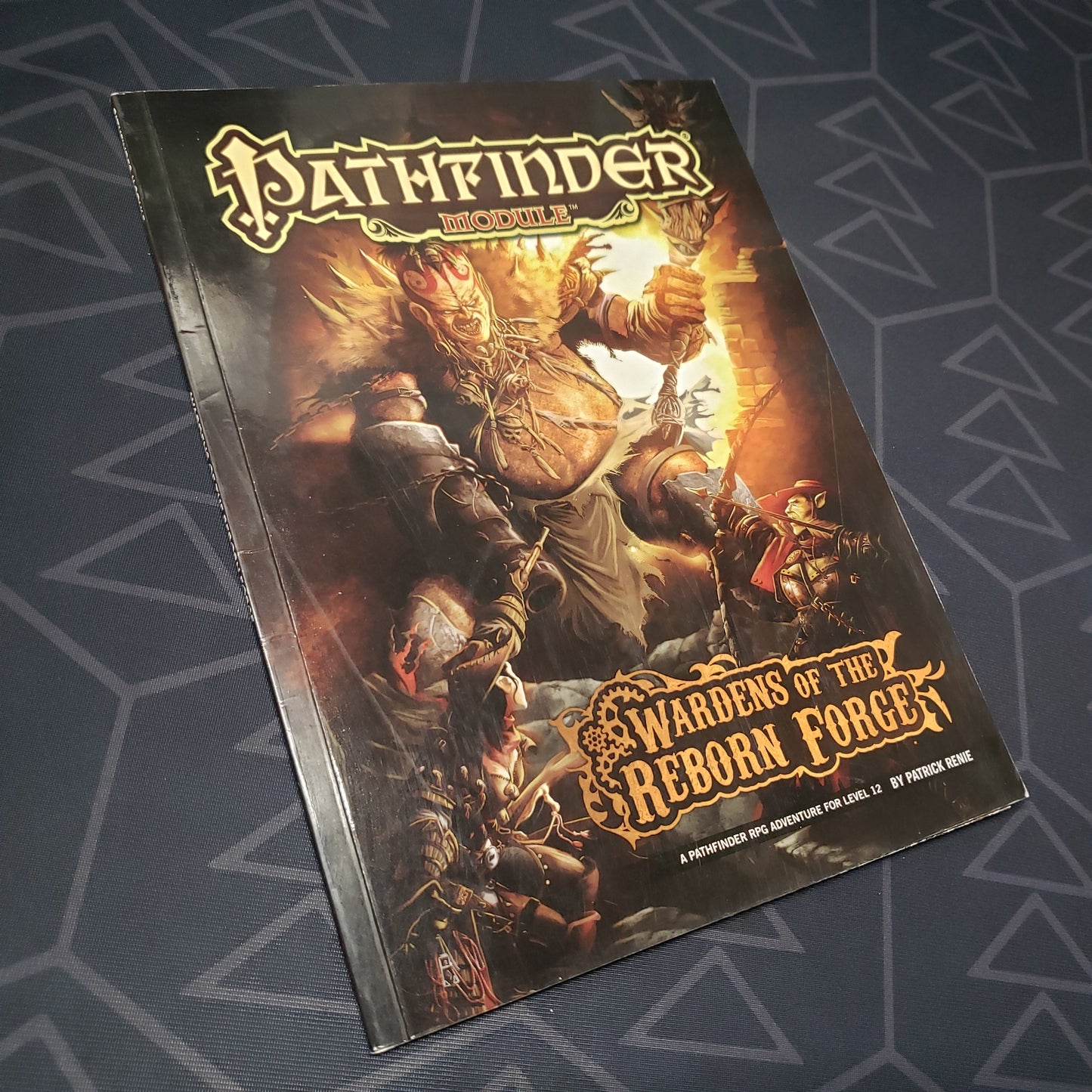 Image shows the front cover of the Wardens of the Reborn Forge book for the Pathfinder 1E roleplaying game
