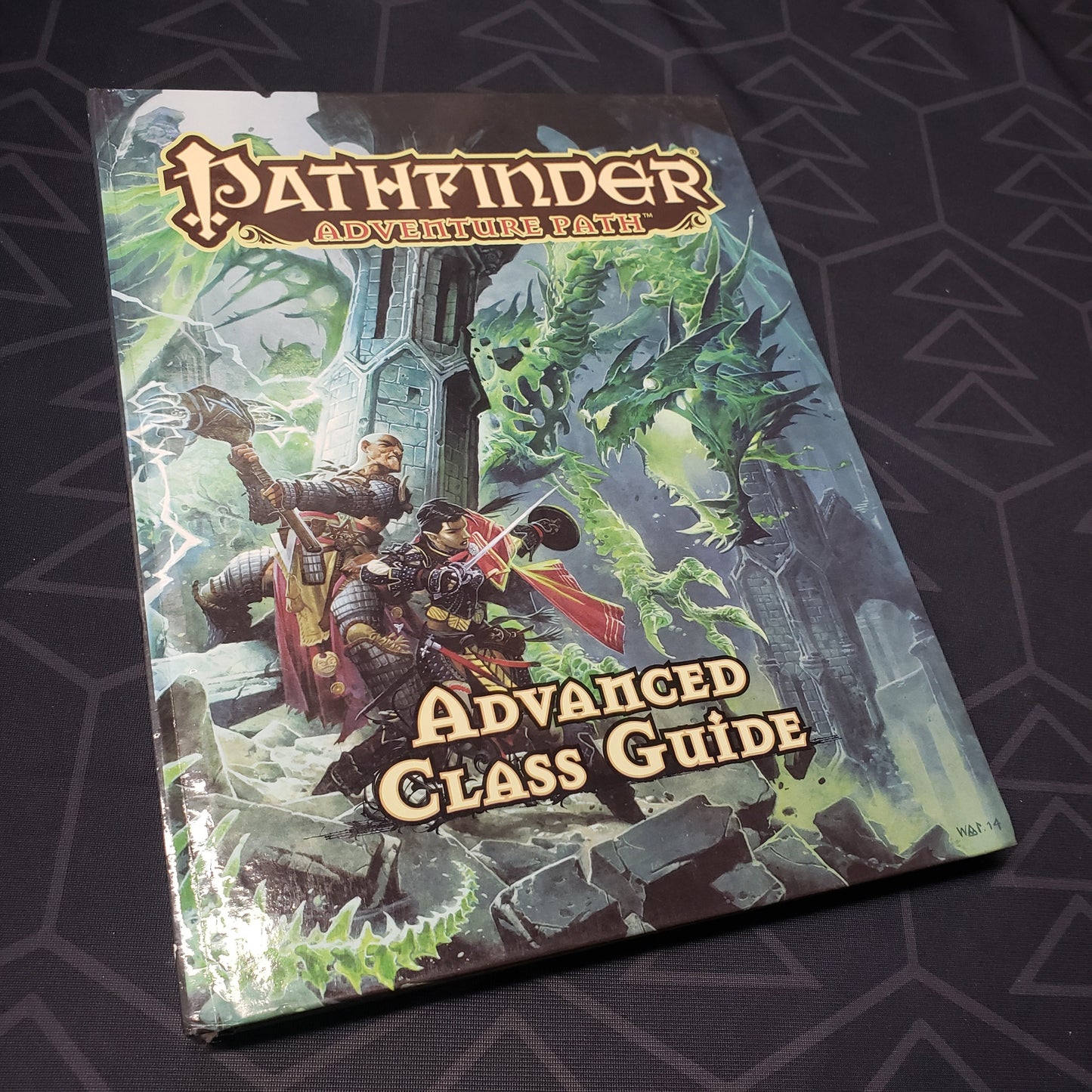 Image shows the front cover of the Advanced Class Guide book for the roleplaying game Pathfinder 1E