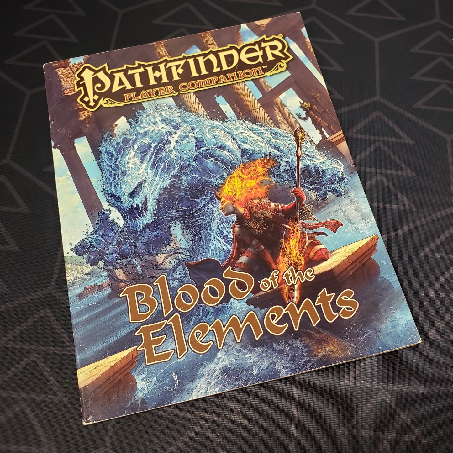 Image shows the front cover of the Blood of the Elements book for the roleplaying game Pathfinder: First Edition