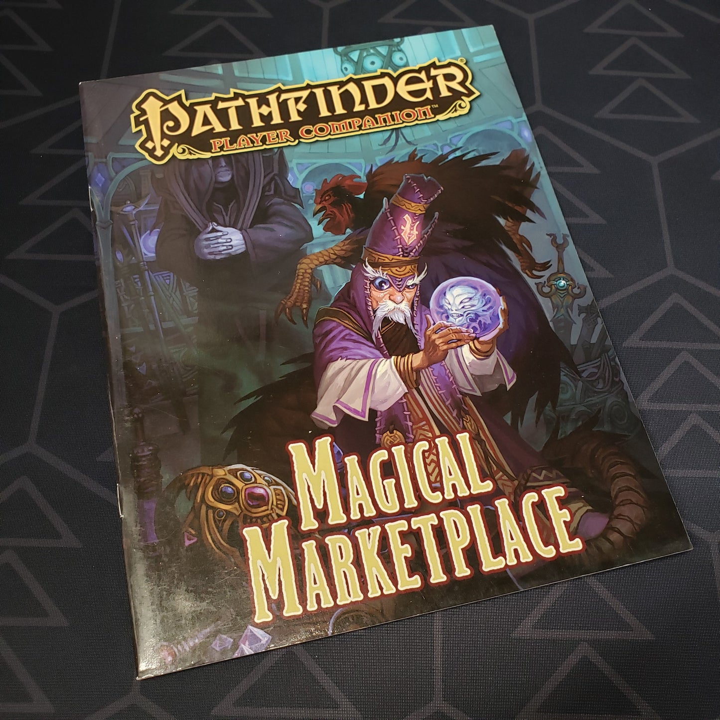 Image shows the front cover of the Magical Marketplace book for the roleplaying game Pathfinder: First Edition