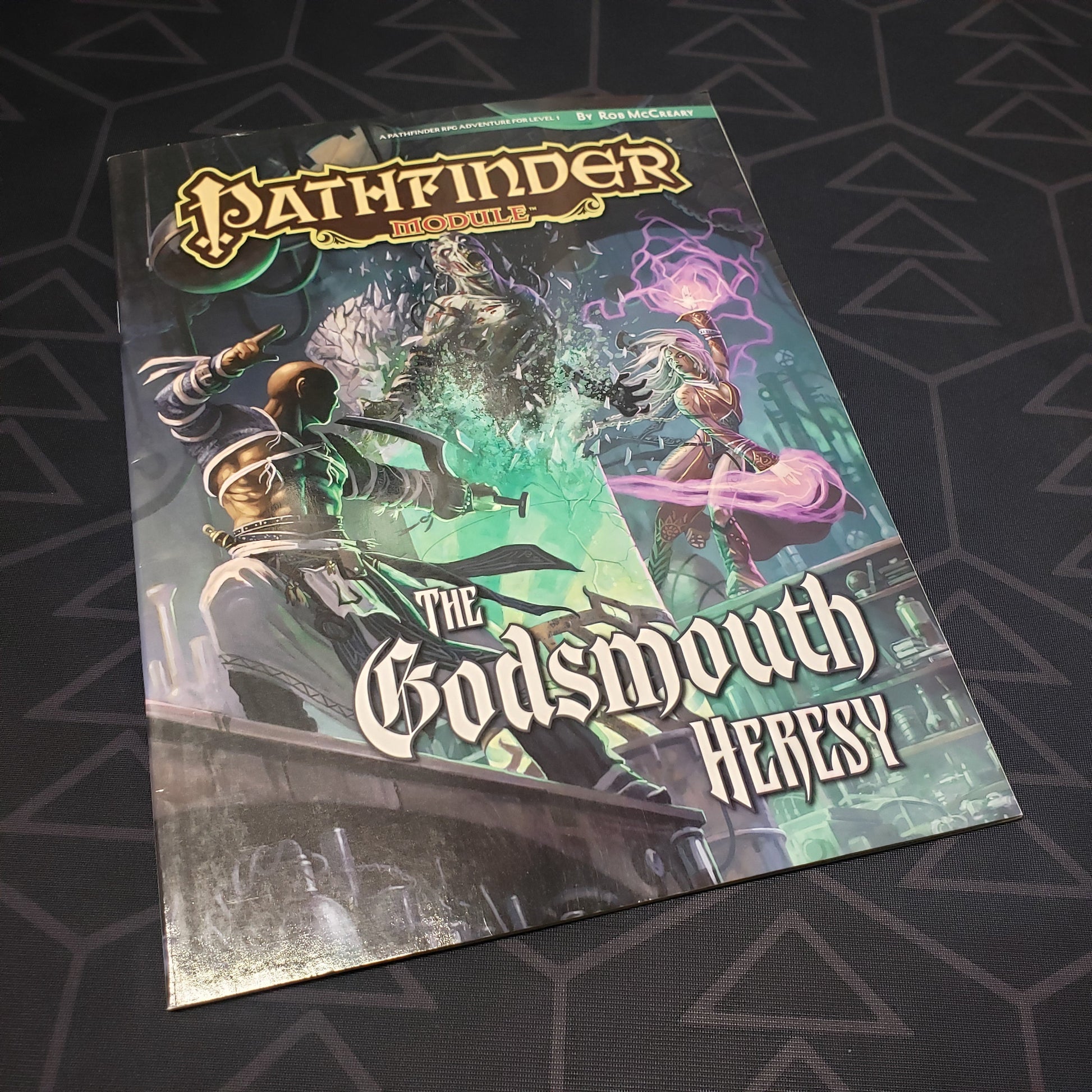 Image shows the front cover of the Godsmouth Heresy book for the roleplaying game Pathfinder: First Edition