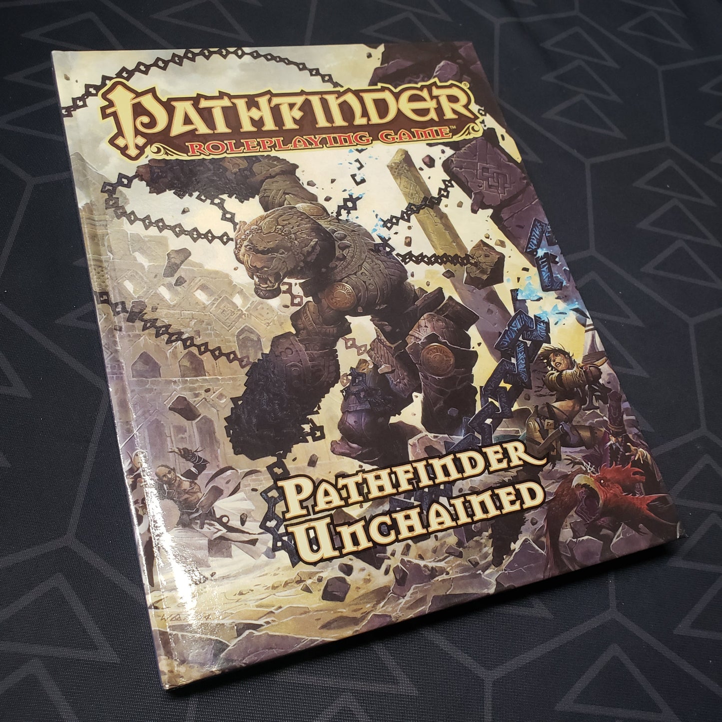 Image shows the front cover of the Pathfinder Unchained book for the roleplaying game Pathfinder 1E