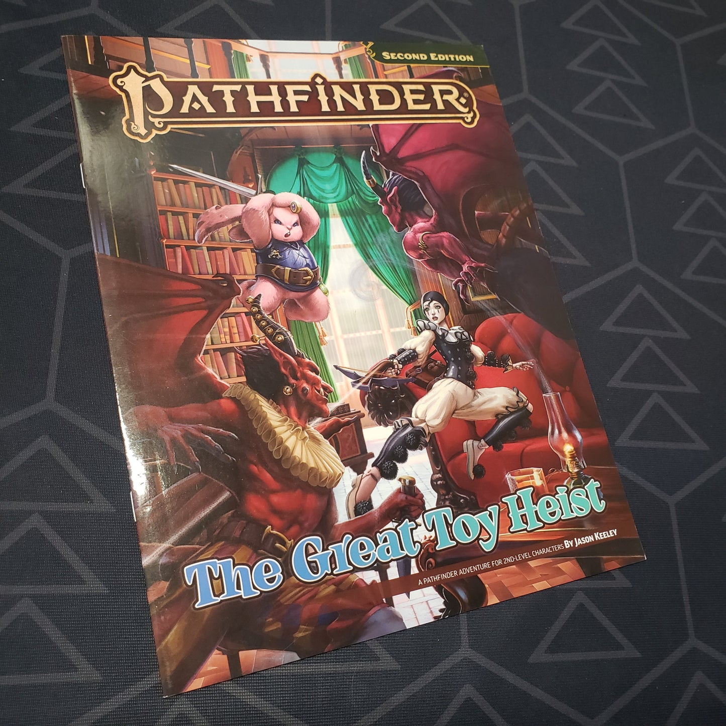 Image shows the front cover of the Great Toy Heist book for the roleplaying game Pathfinder 2E