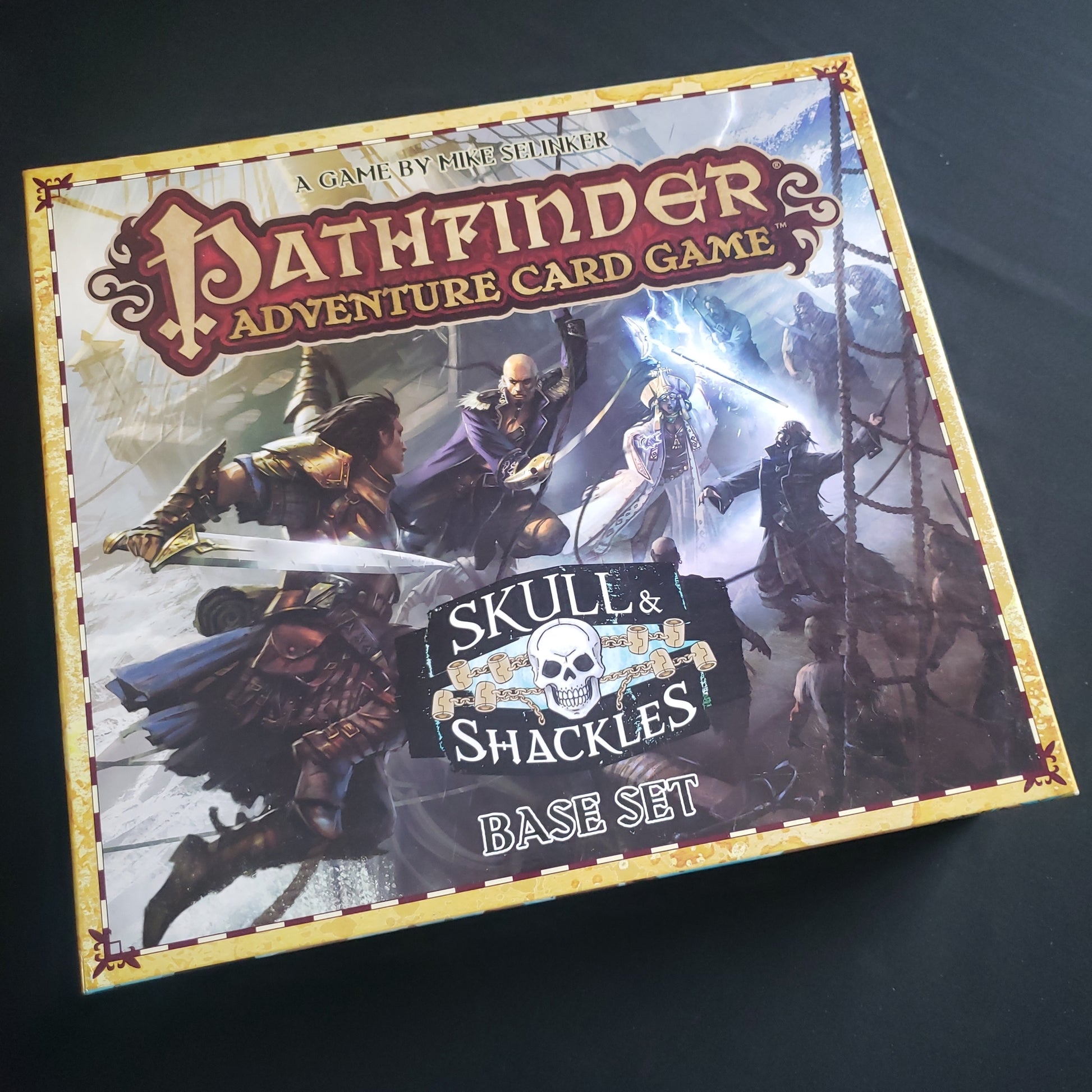 Image shows the front cover of the box of the Skull & Shackles base set for the Pathfinder Adventure Card Game