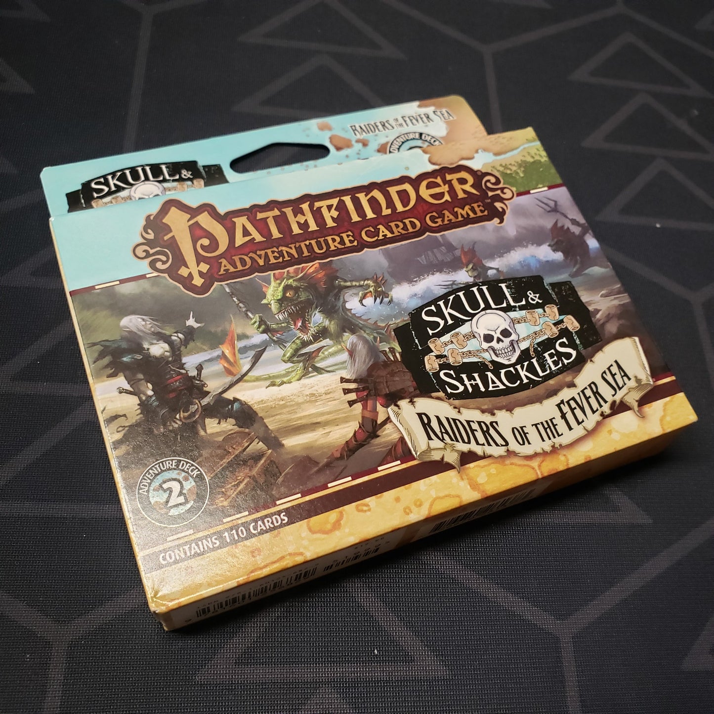 Image shows the front cover of the box of the Skull & Shackles Deck #2: Raiders of the Fever Sea expansion for the Pathfinder Adventure Card Game