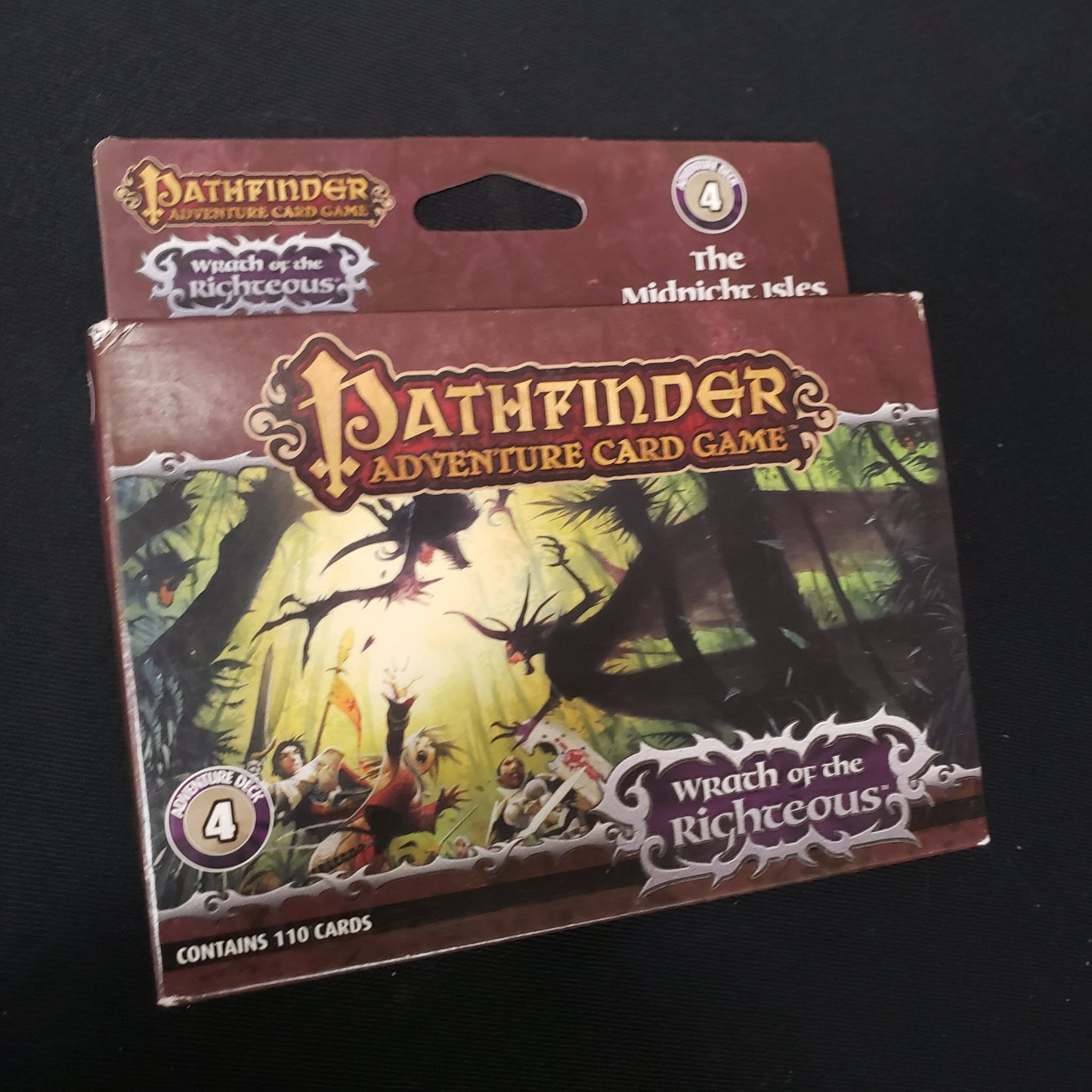 Image shows the front of the box of the Wrath of the Righteous: Adventure Deck 4 - The Midnight Isles for the Pathfinder Adventure Card Game