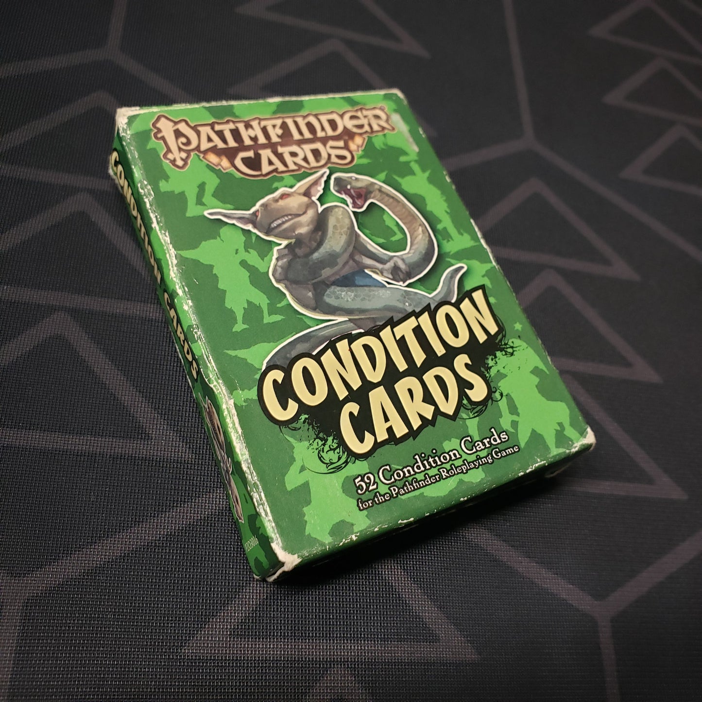 Image shows the front of the box of the Condition Cards deck for the roleplaying game Pathfinder: First Edition