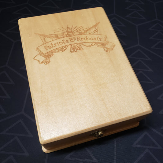 Image shows the top of the wood box of the Collector's Edition for the card game Patriots & Redcoats