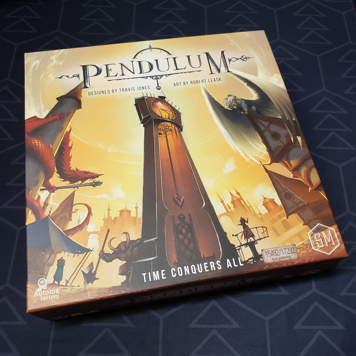 Image shows the front cover of the box of the Pendulum board game