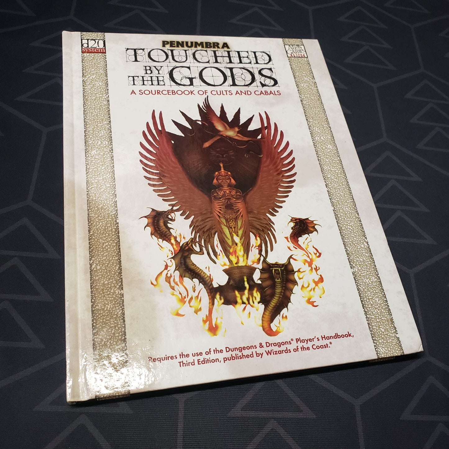 Image shows the front cover of the Penumbra: Touched by the Gods roleplaying game book