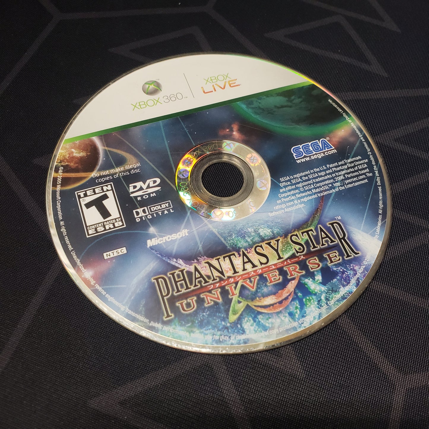 Image shows the game disc for the video game Phantasy Star Universe for Xbox 360